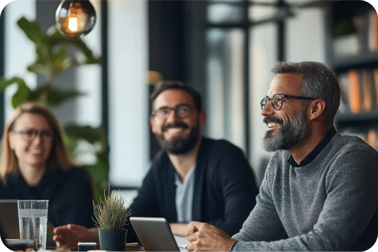 Business man smiling in a meeting